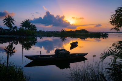 Scenic view of lake against sky during sunset