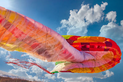 Low angle view of hot air balloons against sky