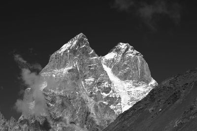 Close-up of rocks against sky