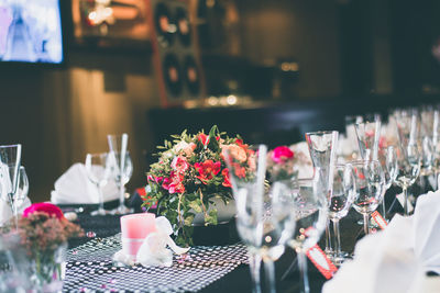 Close-up of wine glasses on dining table