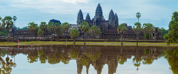Reflection of building and trees in water