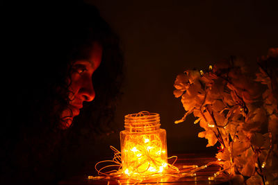 Low angle view of illuminated lantern at night