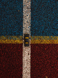 High angle view of yellow road sign