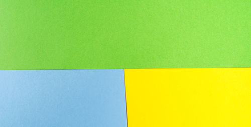 Full frame shot of multi colored paper against wall
