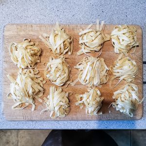 High angle view of fresh pasta on cutting board