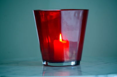 Close-up of red candle on table
