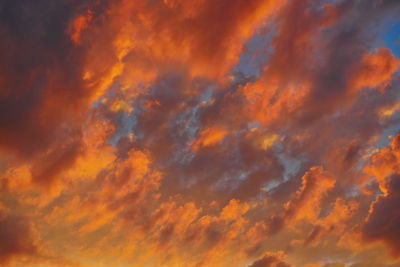 Low angle view of dramatic sky during sunset