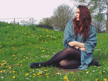 Young woman sitting outdoors