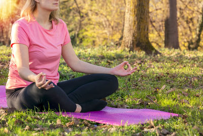 Woman sitting on field