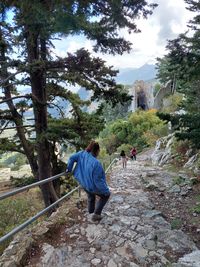 Low angle view of man walking on mountain