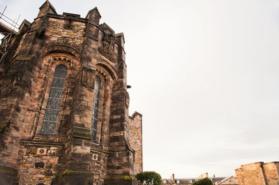 Low angle view of old building against sky