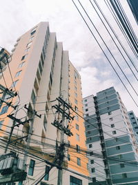 Low angle view of modern buildings against sky