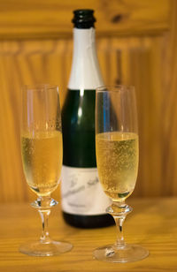 Close-up of sparkling wine in glass on table