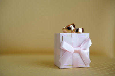 Close-up of wedding rings on box