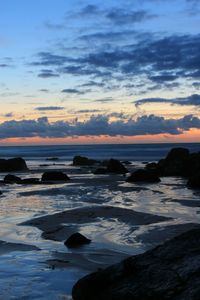 Scenic view of sea against sky at sunset