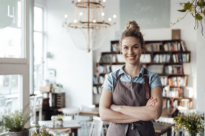 Portrait of a smiling young woman standing outdoors