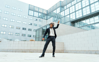 Full length of young man standing on street