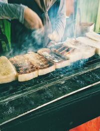 Close-up of meat on barbecue grill