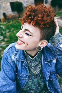 Happy female punk with curly hair