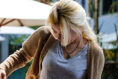 Close-up of young woman standing outdoors