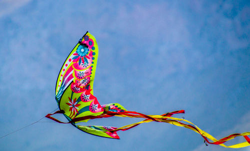 Low angle view of colorful dragon against sky