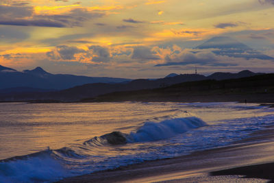 Scenic view of sea against sky during sunset