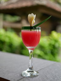 Close-up of red wine glass on table