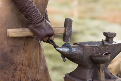 Close-up of hand working on wood