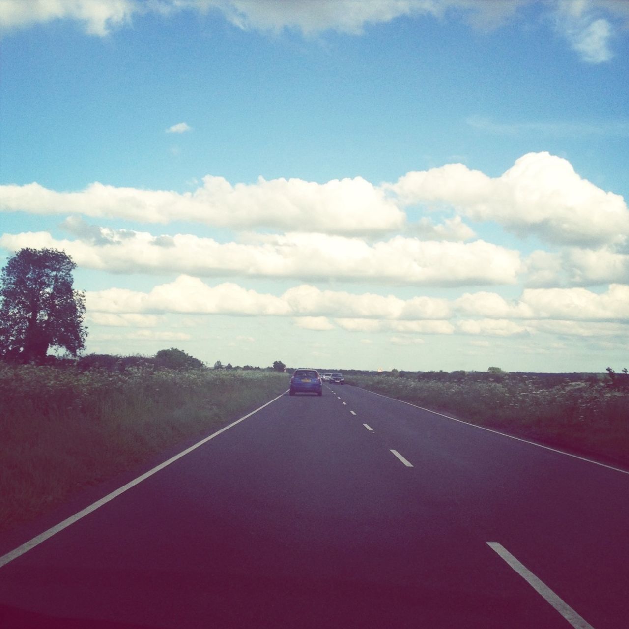 the way forward, transportation, road, sky, diminishing perspective, road marking, vanishing point, cloud - sky, country road, cloud, landscape, tranquil scene, tranquility, empty, cloudy, nature, beauty in nature, scenics, empty road, asphalt