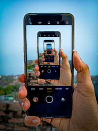 Man photographing with mobile phone