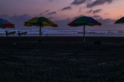 Scenic view of beach against sky during sunset
