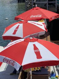 High angle view of red umbrella in city