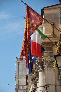 Low angle view of flag against sky
