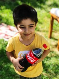 Portrait of boy holding outdoors