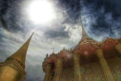 Low angle view of building against cloudy sky