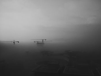 Boats in lake against sky