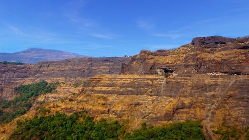 Rock formations on landscape against sky