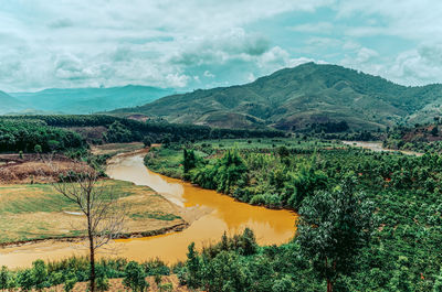 Scenic view of landscape and mountains against sky