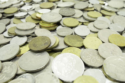 Close-up of coins on white background