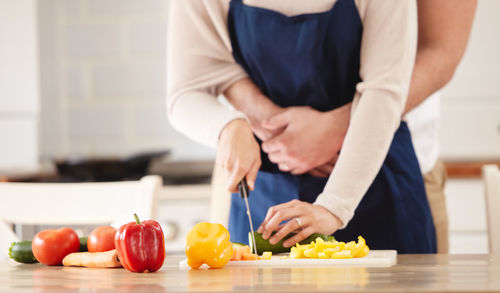 Midsection of man preparing food on table