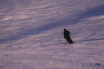 Person skiing on snow covered landscape