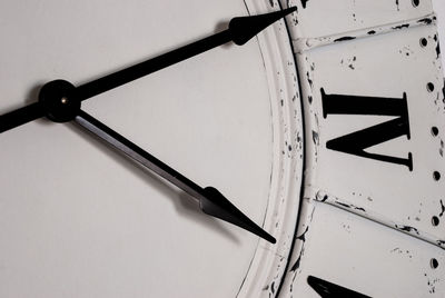 Low angle view of clock on wall
