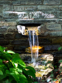 Close-up of water fountain against built structure