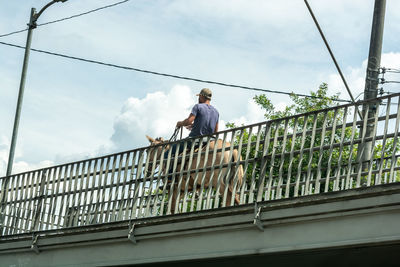 Low angle view of man against sky