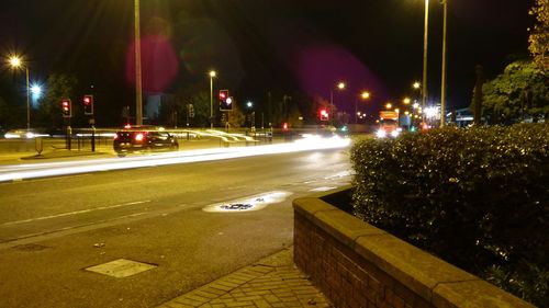 Traffic on city street at night