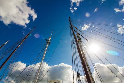 Low angle view of cables against blue sky