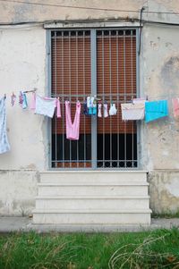 Clothes drying outside house