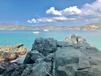 Scenic view of sea against blue sky