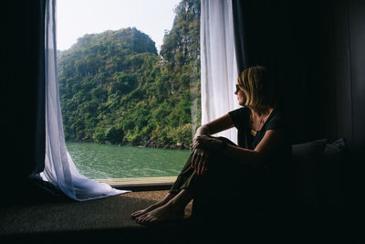 Woman looking at window