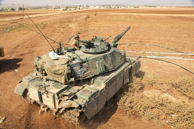 High angle view of man in armor tank on land